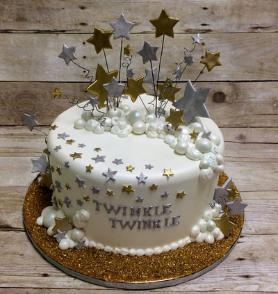 twinkle twinkle baby shower cake. gold and silver stars and gold dust around cake for that bling look.